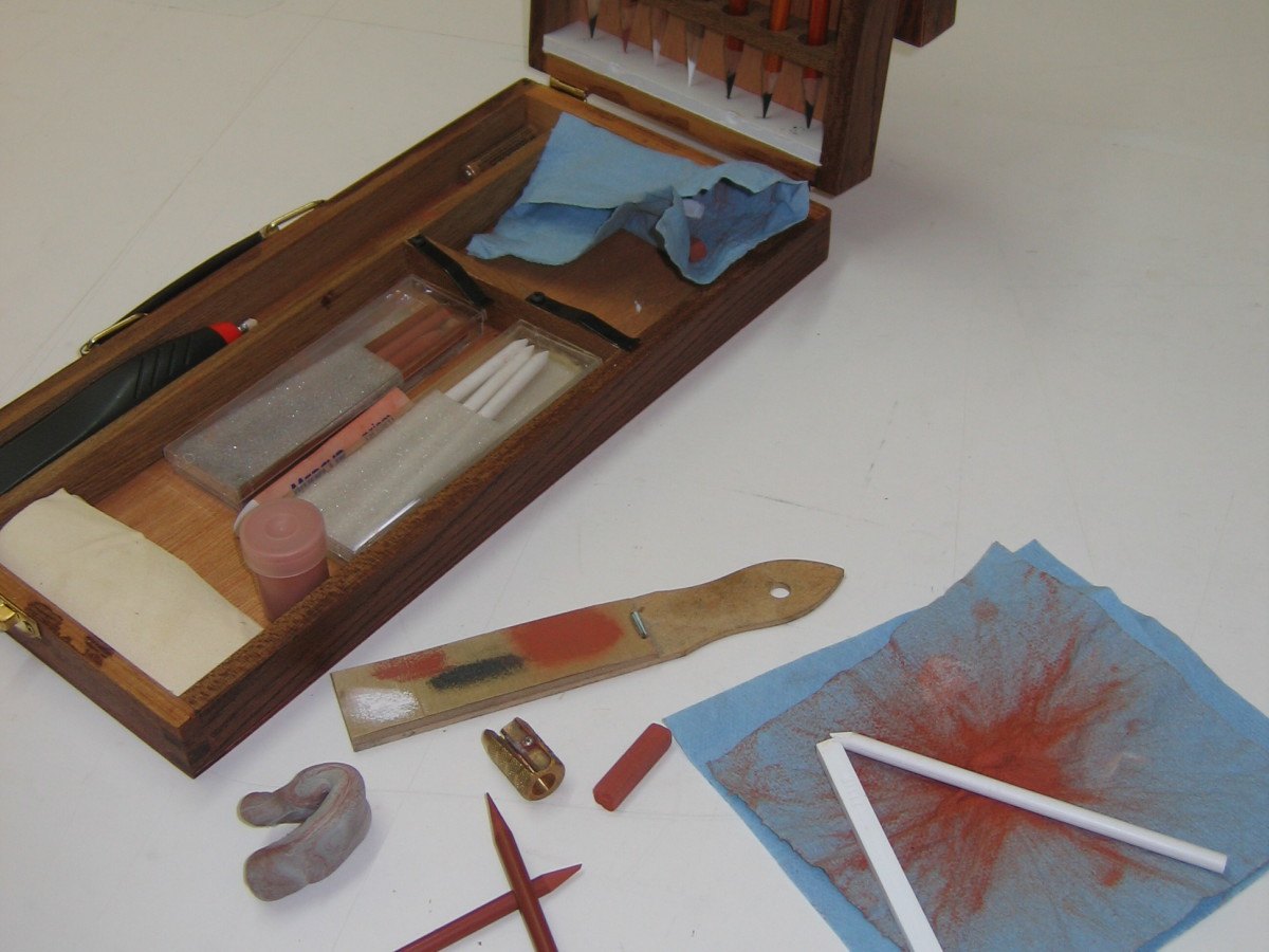 Wooden box of charcoal and drawing tools