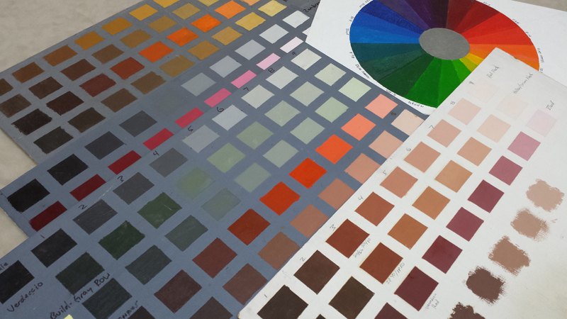 Painted color and skin-tone charts with a color wheel